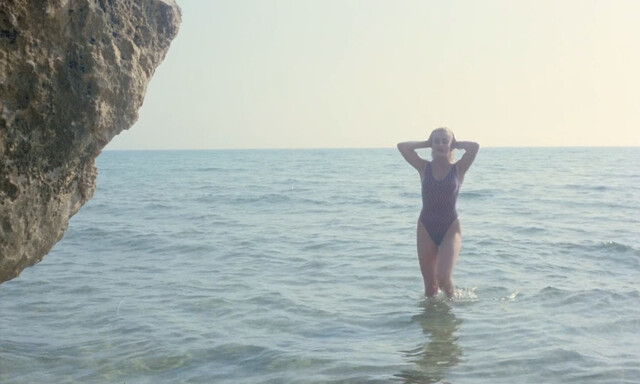 Eva Grimaldi nude – Rat Man (1988)